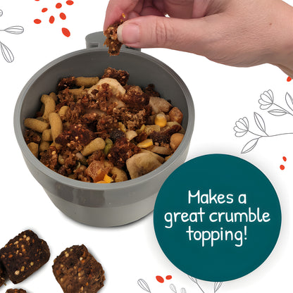 Bird food mix in bowl with hand serving, ideal for avian diets and healthy bird nutrition